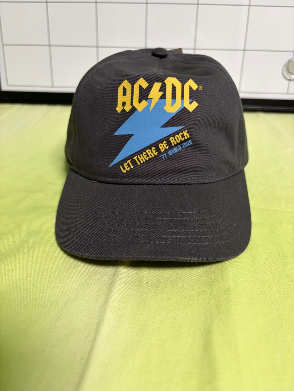 AC/DC Black Hat with Yellow Logo and Blue Lightning